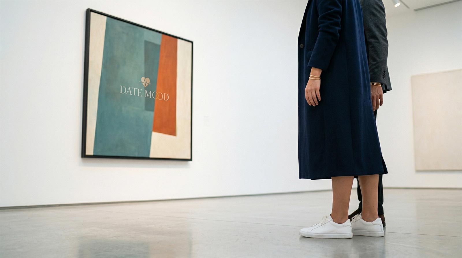 A minimalist point-of-view (POV) photograph from Sarah Jenkins' perspective, showing her white sneakers and the hem of a stylish long coat as she stands in a modern art gallery. Part of a man’s shoulder and arm are visible beside her, both looking at a large abstract contemporary painting. The gallery has clean white walls and soft museum-style overhead lighting. High-end, intellectual, and intriguing atmosphere with a shallow depth of field.